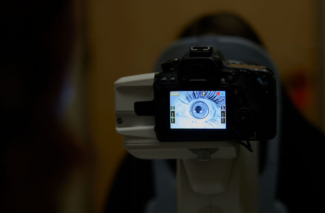close-up of an eye through a camera's view screen
